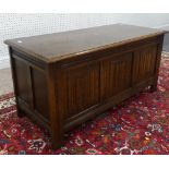 An modern 17thC-style oak Blanket Box, with linen fold panel front and vacant interior, L 104cm x