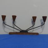 A retro Teak and metal Candelabra, the teak base with four branches, W 33cm x H13cm.