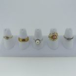 A 9ct yellow gold Band, Size Q, 5.1g, together with two very small three stone diamond rings, an