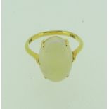 An oval opal Ring, the stone 14.9mm long, claw set in yellow gold, tested as 18ct gold, Size M,