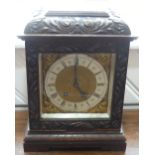 A late Victorian carved oak 8-day mantel Clock, the two-barrel Lenzkirch movement striking on a