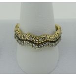 An 18ct gold full Eternity Ring, formed of two conjoined wavy bands, one in white, the other