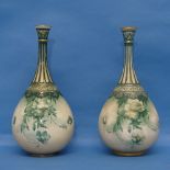 A pair of Hadleys Worcester blush ivory Bottle Vases, the green slender necks, one broken and