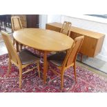 A Danish teak extending Dining Table, unstamped, W 149cm x H 72cm x D 104cm, with four Eva teak