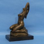 After J. Patoue (20th century), patinated bronze figure of a nude seated on a rock, impressed