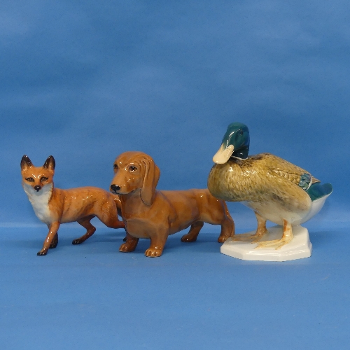 A Beswick figure of a Duck, numbered 817, together with a Beswick Sausage Dog and a Beswick Fox (3)