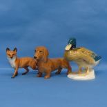 A Beswick figure of a Duck, numbered 817, together with a Beswick Sausage Dog and a Beswick Fox (3)