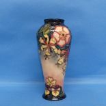 A Moorcroft 'Oberon Honeysuckle' pattern Vase, with impressed and painted marks verso, H 21cm.