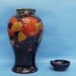 A Walter Moorcroft 'Pomegranate' pattern Baluster Vase, with tube-lined decoration of typical