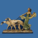 An Art Deco chalkware Statue, depicting a lady walking two dogs, W 54cm x H 44cm