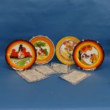 A collection of four limited edition Wedgwood 'Bizarre' Clarice Cliff style Plates, to include '
