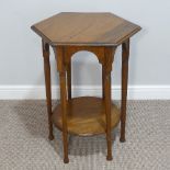 An Arts & Crafts oak Moorish-design hexagonal Occasional Table, raised on six turned and tapering