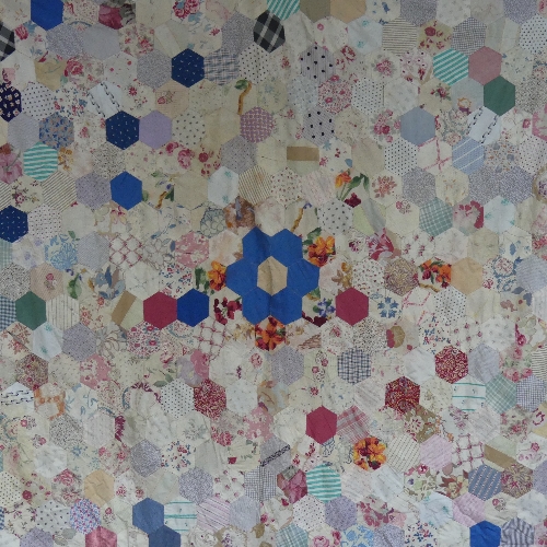 An early 20thC hand-stitched Patchwork Quilt, formed of hexagonal pieces of fabric each 9.5cm, - Image 2 of 2