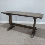 An antique oak plank top Refectory Table, the top with cleated ends, timber is in an overall worn