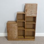 A Heals style limed oak Bookcase, circa 1930's, with open shelves and two cupboards in a stepped