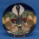 A Moorcroft Pottery 'Fantail' pattern Plate, designed by Philip Gibson, c.2003, 22.5cm diameter.