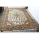 A large Indian finely hand-knotted wool Carpet, dark gold and brown geometric designs on a cream