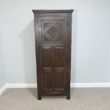 An antique style carved oak Cupboard/Wardrobe, fitted with hanging rail, W 76cm x H 182cm x D 48cm