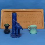 A vintage Brannam Pottery terracotta Advertising Plaque, W 51cm x H 25.5cm, together with three