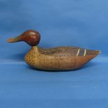 An antique carved Decoy Duck, possibly American, in the form of a mallard, in original paint, L 29cm