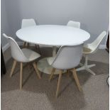 Mid-20th century design: a white circular Tulip Dining Table by Arkana with one original matching