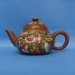 An antique Chinese Yixing famille rose terracotta Teapot, decorated in typical fashion, with incised