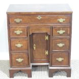 An antique style kneehole Desk, with quarter-veneered burr walnut top, the whole with crossbanding