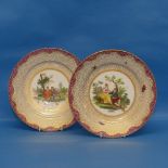 A near pair of continental porcelain Cabinet Plates, each decorated centrally with classical scenes,