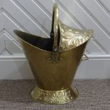 An Art Nouveau brass Coal Bucket, embossed with panels of stylised foliate decoration, W 42cm x H