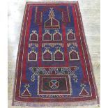 Tribal Rugs; a Persian hand-knotted woollen Prayer Rug, blue and red ground, one small hole, 180cm x