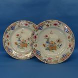 A pair of 18thC Chinese porcelain famille rose Plates, decorated in flora with central still life