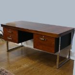 A Gordon Russell rosewood 'Prestige' Desk, designed by Trevor Chinn, circa 1970's, the veneered