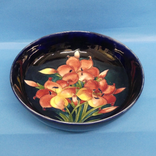 A Moorcroft 'Hibiscus' pattern Bowl, tube lined design in typical style, signed W Moorcroft to base,