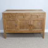 A Heals style limed oak sideboard, circa 1930's, three drawers over two cupboards, the drawers