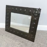 An Arts & Crafts copper framed rectangular Wall Mirror, with hammered and embossed beaded