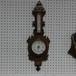 An Edwardian aneroid  Barometer / Thermometer, in carved oak case, 66cm high, together with a