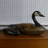 A large wooden decorative Decoy Goose, the underside with makers labe, 'Big Sky Carvers', L 50cm x