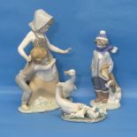 A Lladro 'Avoiding the Goose' Group, depicting two young figures avoiding an angry goose, together