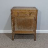 A Heals limed oak Cupboard, circa 1930's, with single frieze drawer above panelled cupboard door,