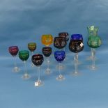 A harlequin set of six coloured Glasses, cut to colour, H 20cm, together with a smaller set, H