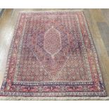 Tribal Rugs: a fine Persian Senneh hand knotted muted red-ground rug, wool on cotton, the whole