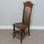 An Arts & Crafts oak bobbin-turned spindle back Hall Chair, W 43cm x H 101cm x D 41cm.