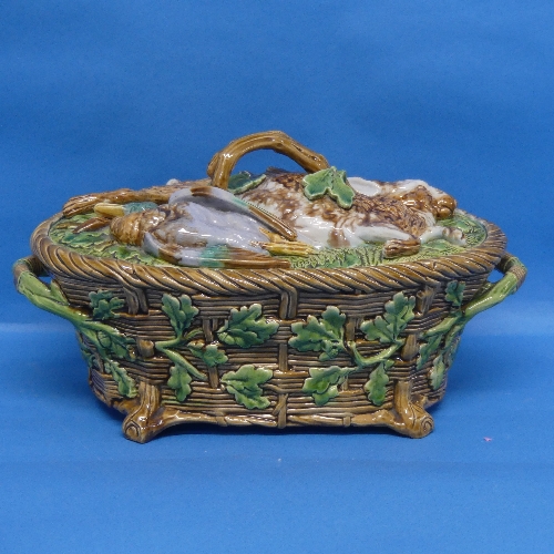 A Minton majolica Game Pie Dish and Cover, late 19thC, the lid modelled as game resting on ferns and