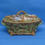A Minton majolica Game Pie Dish and Cover, late 19thC, the lid modelled as game resting on ferns and