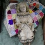 An Armand Marseille Dream baby doll, with sleeping eyes, on cloth rag body, together with an early