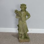 Garden statuary; a reconstituted stone figure of a woman carrying wheat, H 79cm