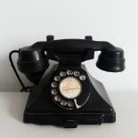 Railwayana; A Bakelite Telephone ; black bakelite phone with Rotary dial,  marked "Bridport 3107" in