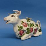 A Wemyss Ware "Bovey Tracey" Pottery Cow Creamer, painted in polychrome with flowers, script mark in