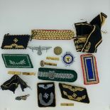 A quantity of German and British WW2 period Insignia, both originals and reproductions, including an