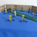 A Lamplough's Model Cricket game, comprising eleven tinplate cricketers including two batsmen,